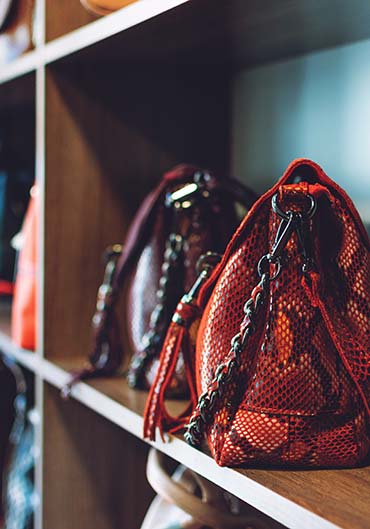 fashion trend snakeskin print handbags on shelf in a store, shop